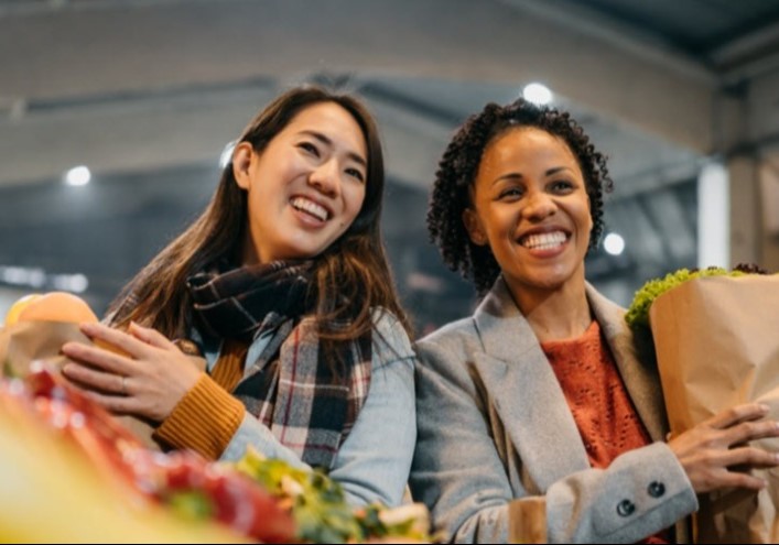 Millennial aged women shopping for groceries
