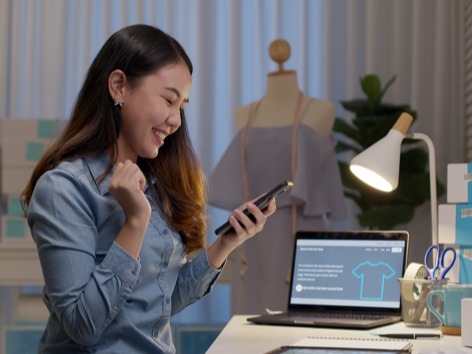 Small business owner reviewing finances Cash Management Solutions