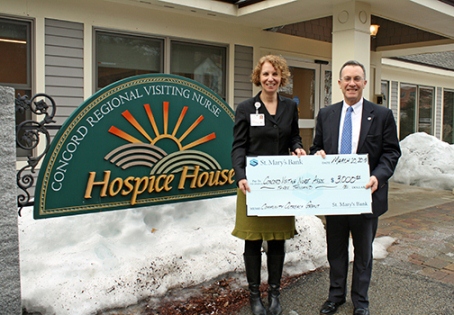 Tom Champagne of St. Mary's Bank Presents Laurie Farmer of Hospice Services with $3000 check